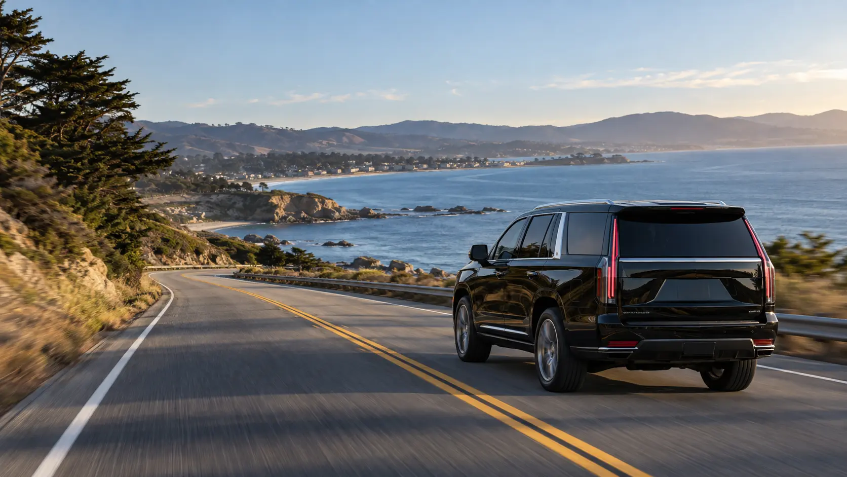 Black luxury SUV traveling toward Monterey Bay from San Jose Airport